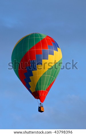 Hot air balloon on sky before landing