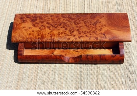 rare cedar wood pencil case on straw mat