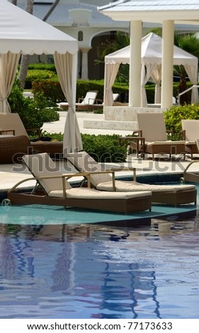 luxury hotel resort pool, chairs and patio