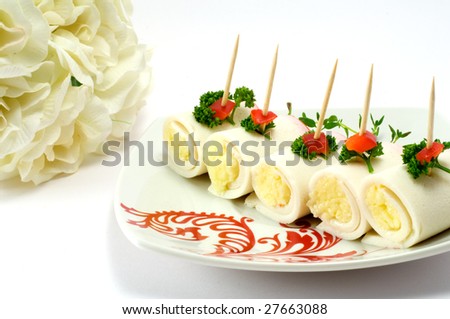 Crab meat sticks with cheese on a white background