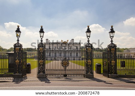LONDON UK - MAY 15, 2014: Old English park south of London, Queen\'s palace and main lace gate, 1619. Was built as an adjunct to the Tudor Palace.