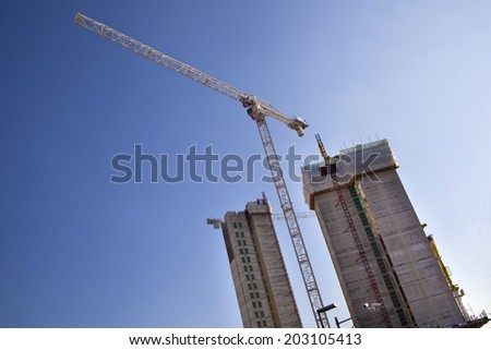 LONDON, UK - MAY 17, 2014: Building site with cranes in centre of London