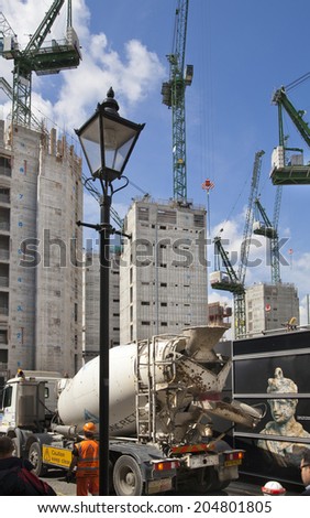 LONDON, UK - JULY 03, 2014: Big building site in the Bank of England aria. Erasing new office and apartment buildings