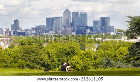 LONDON UK - JULY 28, 2014: View on business district Canary Wharf from old English park, south of London