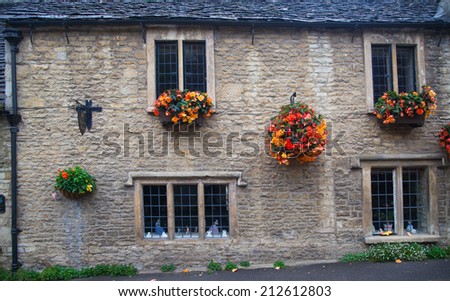 WILTSHIRE, CHIPPENHAM, UK - AUGUST 9, 2014: Castle Combe, unique old English village with luxury hotel accommodation and golf club