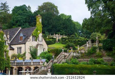 WILTSHIRE, CHIPPENHAM, UK - AUGUST 9, 2014: Castle Combe, unique old English village with luxury hotel accommodation and golf club