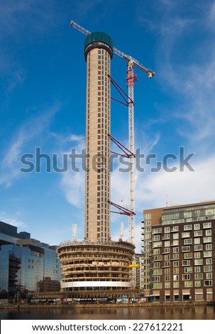 LONDON, UK - AUGUST 16, 2014: Building site with cranes on Canary Wharf aria, London.