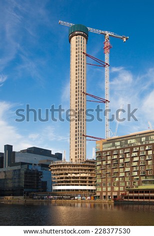 LONDON, UK - AUGUST 16, 2014: Building site with cranes on Canary Wharf aria, London.