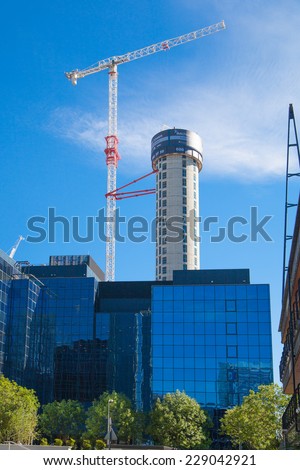 LONDON, UK - JULY 3, 2014: Building site with cranes on Canary Wharf aria, London.