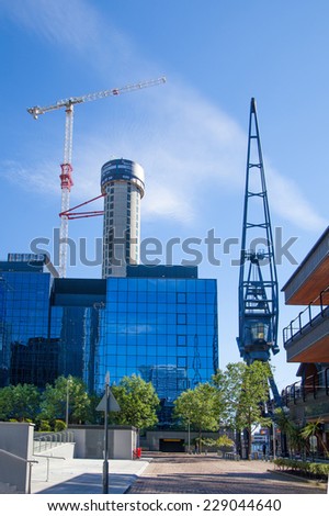 LONDON, UK - JULY 3, 2014: Building site with cranes on Canary Wharf aria, London.