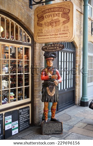 LONDON, UK - 22 JULY, 2014: Old Pub in Covent Garden market, one of the main tourist attractions in London, known as restaurants, pubs, market stalls, shops and public entertaining.