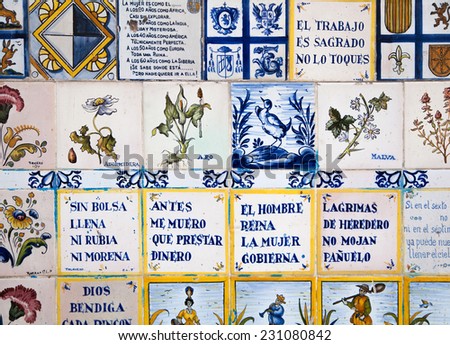 MADRID, SPAIN - July 22, 2014:  Decorative tiles on Madrid street. National decorative art with agricultural symbols