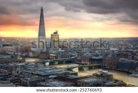 LONDON, UK - JANUARY 27, 2015: Shard of glass City of London, business and banking aria. London\'s panorama in sun set. View from the St. Paul cathedral