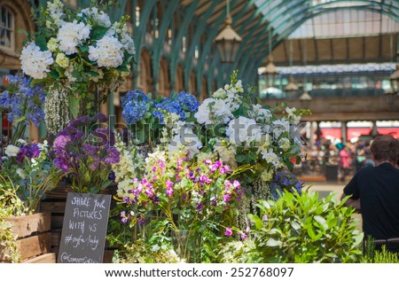 LONDON, UK - 22 JULY, 2014: Flower shop Covent Garden market, one of the main tourist attractions in London, known as restaurants, pubs, market stalls, shops and public entertaining.
