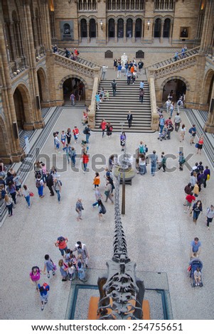 LONDON, UK - AUGUST 11, 2014: People in National History Museum, is one of the most favourite museum for families in London.
