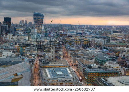 LONDON, UK - JANUARY 27, 2015: Busy streets of City of London in the dusk. First evening lights and sunset. London\'s panorama from the St. Paul cathedral