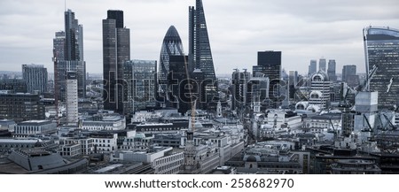 LONDON, UK - JANUARY 27, 2015: City of London, business and banking aria. London's panorama in sun set. View from the St. Paul cathedral