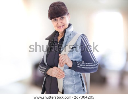 Pension age good looking woman in sport outfit