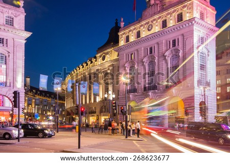 LONDON, UK - AUGUST 22, 2014: Piccadilly Circus in night. Famous place for romantic dates. Square was built in 1819 to join of Regent Street