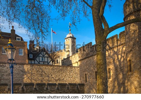 LONDON, UK - APRIL15, 2015: Tower of London (started 1078), old fortress, castle, prison and house of Crown Jewels. View form the river side park