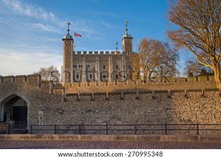 LONDON, UK - APRIL15, 2015: Tower of London (started 1078), fortress and house of Royal Crown Jewels. View form the river side park