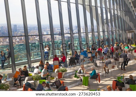 LONDON, UK - APRIL 22, 2015: People in the restaurant of the public Sky Garden . Viewing platform is highest UK garden, locates at the 32 floor and offers amazing skyline of London city.