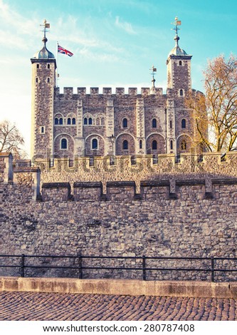LONDON, UK - APRIL 15, 2015: Tower of London (started 1078), old fortress, castle, prison and house of Crown Jewels. View form the river side park