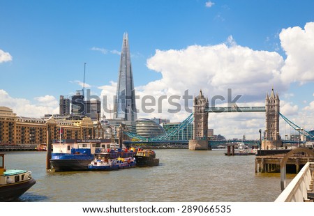 LONDON, UK - APRIL 30, 2015: Tower bridge and Shard of glass view from the River Thames