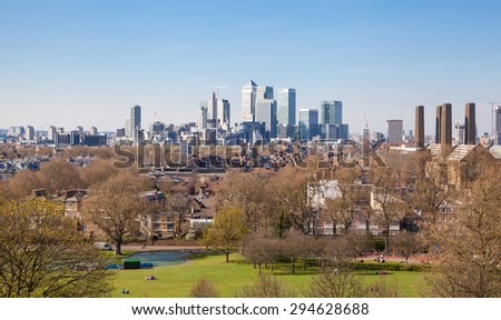 LONDON, UK - APRIL 14, 2015: Canary Wharf view from the Greenwich hill. Modern skyscrapers of banking aria