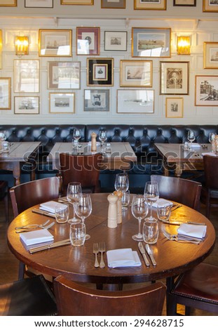 LONDON, UK - APRIL 14, 2015: Old English victorian public house interior. Early morning settings with no people