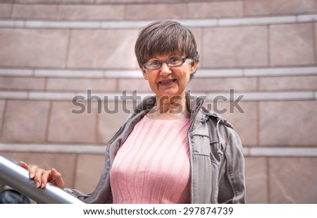Pension age good looking woman portrait in the City