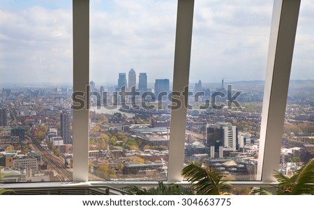 LONDON, UK - APRIL 22, 2015: Canary Wharf view from the Sky Garden Walkie-Talkie building. Viewing platform is highest UK garden, locates at the 32 floor and offers amazing skyline of London city.