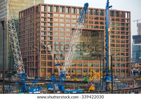 LONDON, UK - SEPTEMBER 9, 2015: Building construction site with cranes and industrial units  in Canary Wharf aria