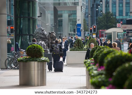 LONDON, UK - SEPTEMBER 14, 2015:  Office workers going at work. Early morning hours in Canary Wharf business life