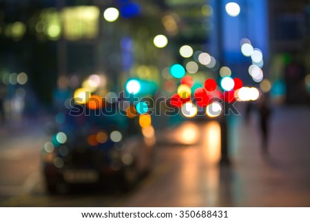 Blurred background of night city with lots of lights reflections. Template for designer\'s projects