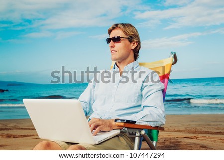 Young Business Man Working Remotely on Tropical Beach