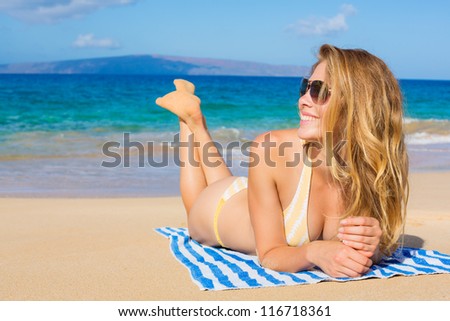 Beautiful Woman Sunbathing on Tropical Beach