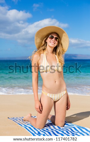 Beautiful Happy Young Woman Relaxing in the Sun on Tropical Beach