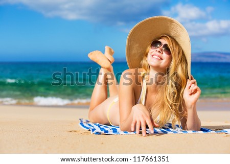 Beautiful Woman Sunbathing on Tropical Beach