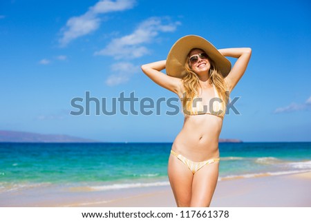 Happy Beautiful Young Woman at the Beach in Bikini