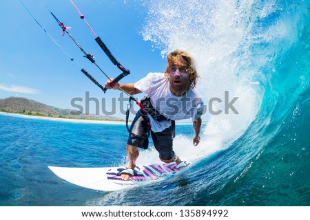 Extreme Sport, Kite Surfer Riding Wave getting Barreled