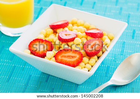 Bowl of Cereal with Fresh Strawberries