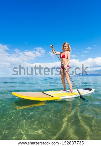 Attractive Woman on Stand Up Paddle Board, SUP, Tropical Blue Ocean, Hawaii