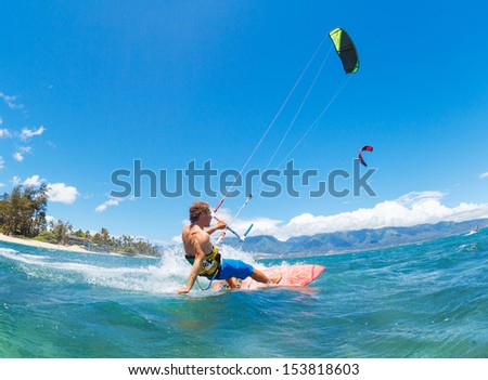 Young Man KiteBoarding, Fun in the ocean, Extreme Sport Kitesurfing