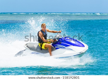 Young Man On Jet Ski, Tropical Ocean, Vacation Concept
