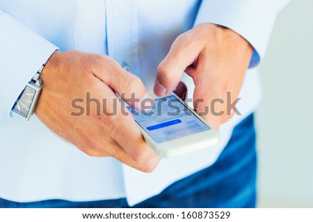 Young Professional, Handsome Man Using Smart Mobile Phone, Texting, Sending Text Message