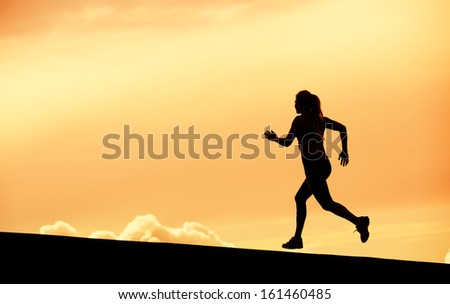 Female Runner Silhouette, Running into sunset, colorful sunset sky