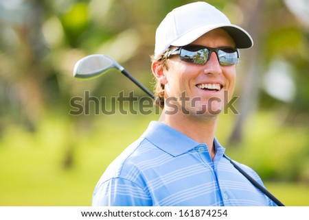 Athletic Young Man Playing Golf, Portrait Of Golfer On Course With Driver