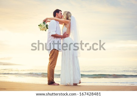 Bride and Groom Watching Sunset on Beautiful Tropical Beach, Romantic Married Couple