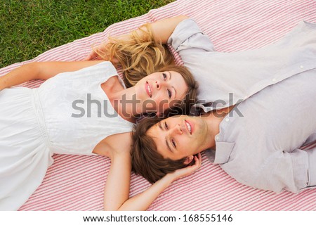 Romantic picnic in the park, loving couple on blanket outdoors on grass